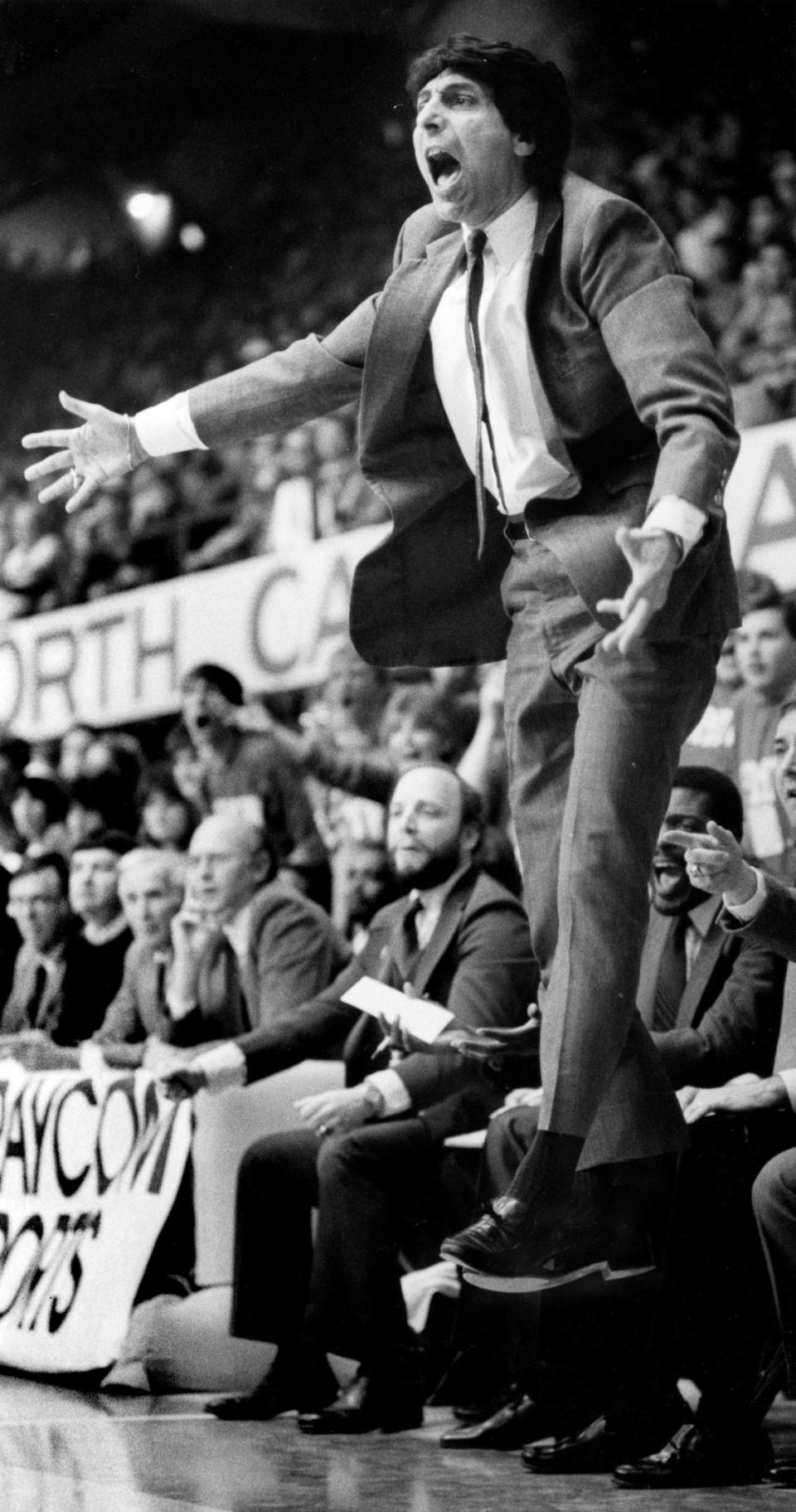 NC State coach Jim Valvano leaps off the floor during the Wolfpack’s 85-76 victory over the rival Tar Heels of North Carolina on Feb. 17, 1985.