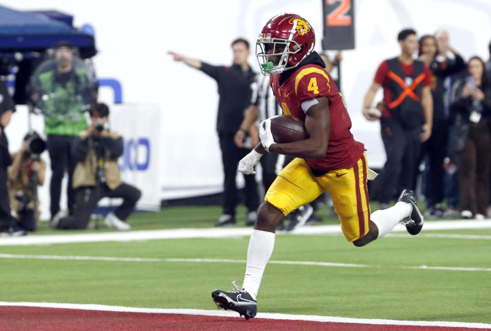 Southern California wide receiver Mario Williams (4) scores a touchdown against Utah during the second half of the Pac-12 Conference championship NCAA college football game Friday, Dec. 2, 2022, in Las Vegas. (AP Photo/Steve Marcus)