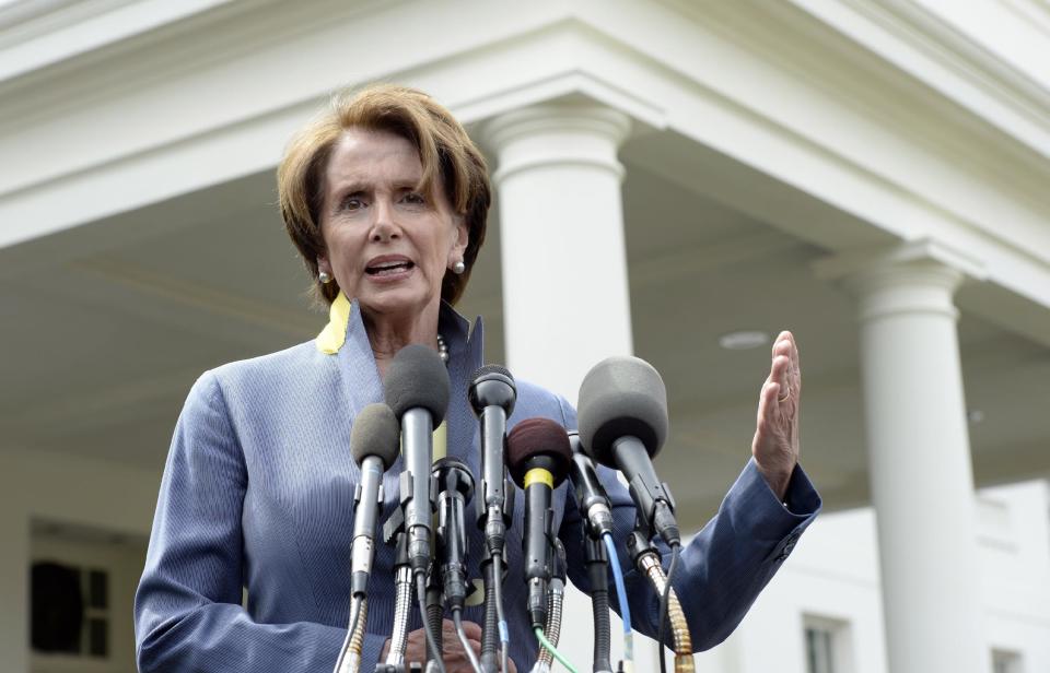 House Minority Leader Nancy Pelosi of Calif. speaks to reporters outside the West Wing of the White House in Washington, Tuesday, April 1, 2014, following her lunch with President Barack Obama. Pelosi was asked several questions about the Affordable Care Act. (AP Photo/Susan Walsh)