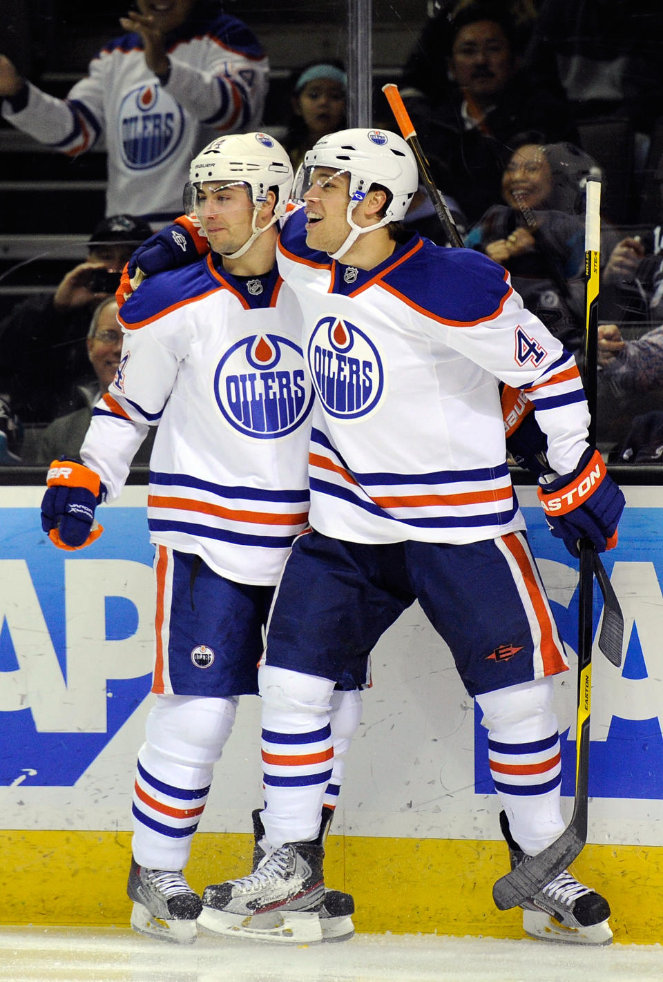 SAN JOSE, CA - MARCH 06: Jordan Eberie #14 and Taylor Hall #4 of the Edmonton Oilers celebrates after Eberie scores a goal 10 seconds into the game against the San Jose Sharks at HP Pavilion at San Jose on March 6, 2012 in San Jose, California. (Photo by Thearon W. Henderson/Getty Images)