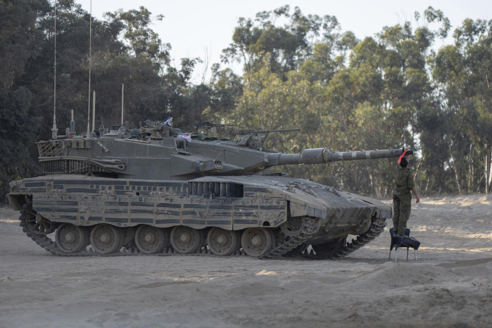 Israeli soldier check a tank near the Gaza Strip border in southern Israel, Thursday, June 13, 2024. The army is battling Palestinian militants across Gaza in the war ignited by Hamas' Oct. 7 attack into Israel. (AP Photo/Ohad Zwigenberg)