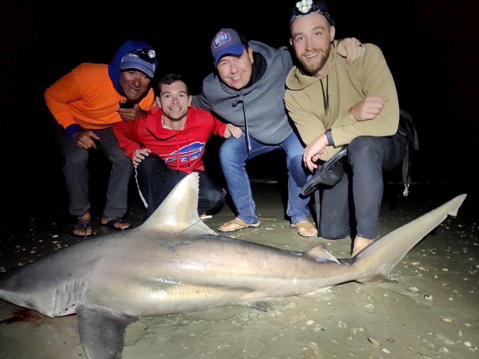 These visitors from New York brought in a 6-foot blacktip with the help of NSB Shark Hunters.