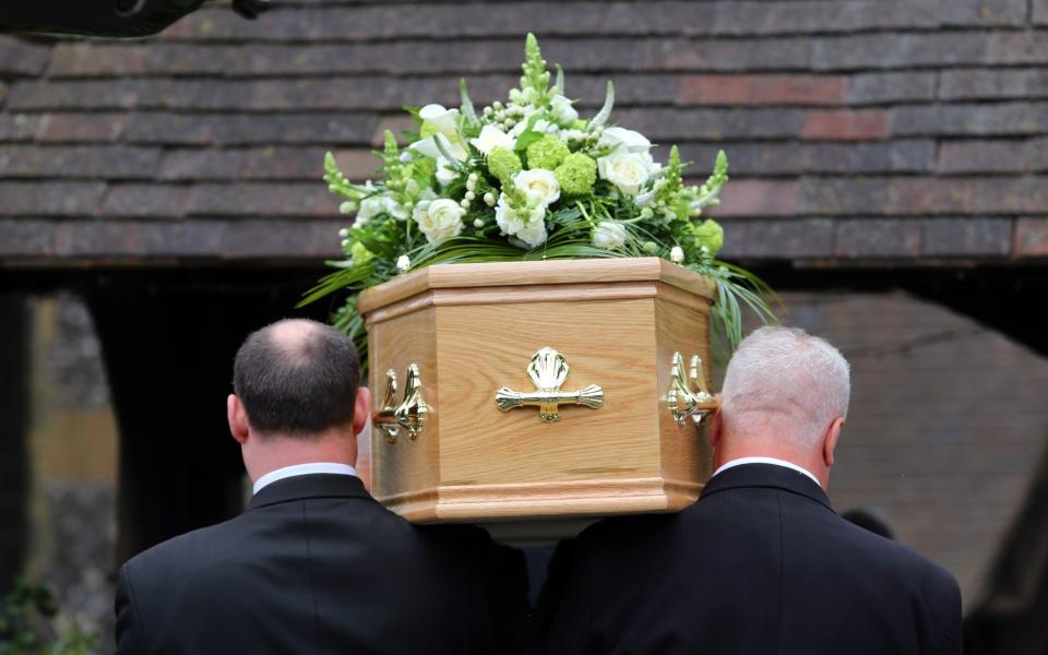 Undated file photo of a funeral taking place. The Co-op has stepped up its efforts in a price war with other funeral providers with an extension on its guarantee to beat competitor quotes. PRESS ASSOCIATION Photo. Issue date: Monday October 1, 2018. In yet another aggressive move designed to put pressure on its rivals, Co-op on Monday extended its price guarantee to all funeral plans and probate fees. See PA story CITY Funeral. Photo credit should read: PA Wire - PA Wire