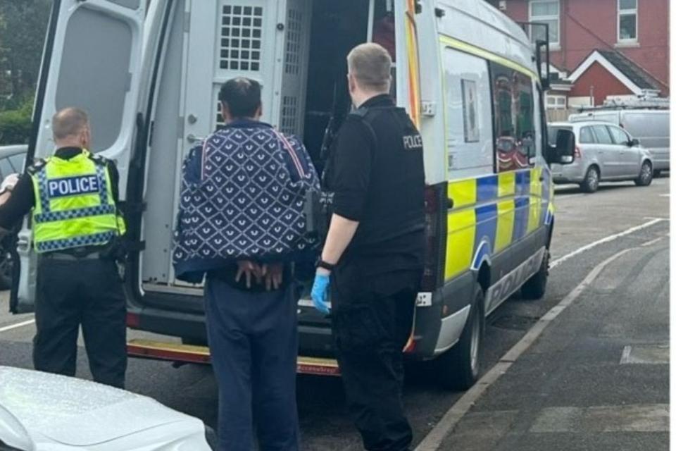 Bournemouth Echo: Bournemouth police smashing through Richmond Park Crescent home