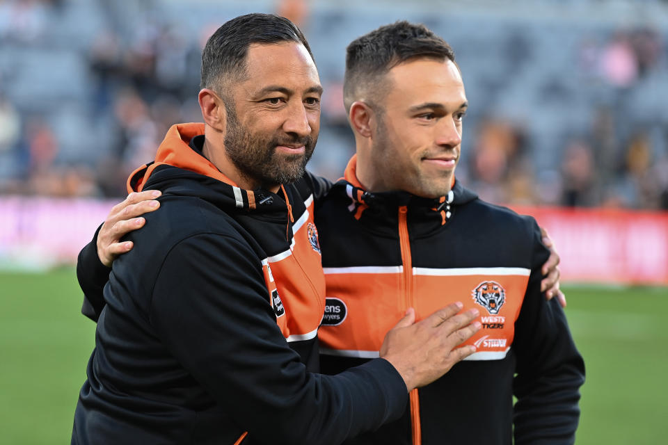 SYDNEY, AUSTRALIA - AUGUST 19: Benji Marshall and Luke Brooks of the Tigers after the round 25 NRL match between Wests Tigers and Dolphins at CommBank Stadium on August 19, 2023 in Sydney, Australia. (Photo by Izhar Khan/Getty Images)