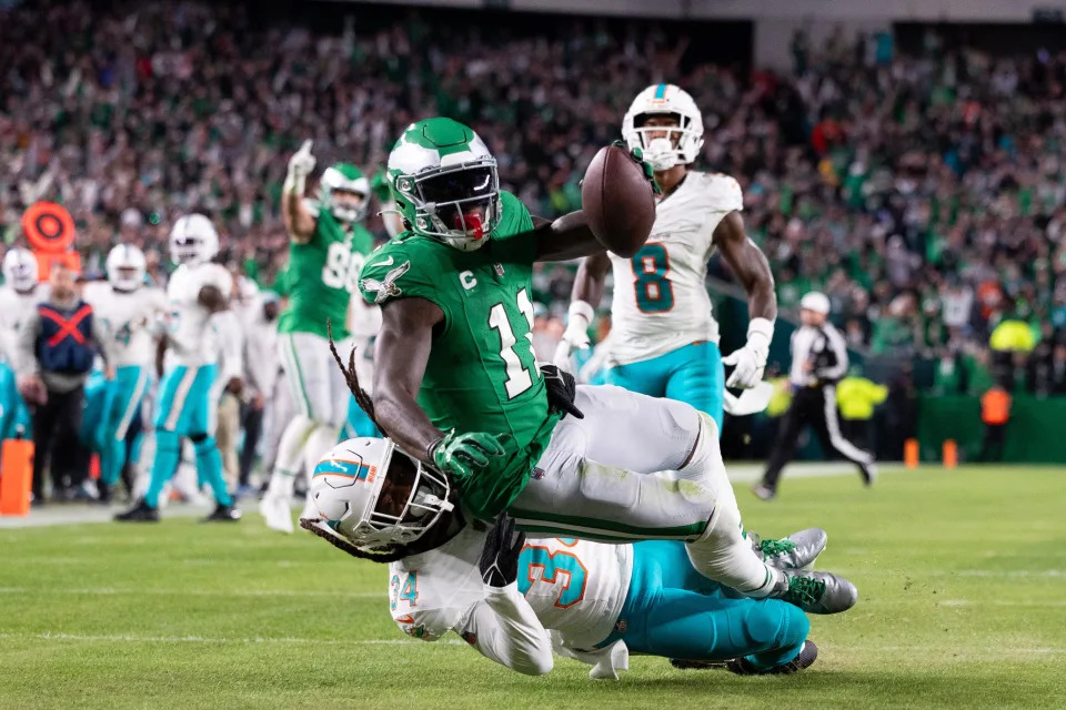 Oct 22, 2023; Philadelphia, Pennsylvania, USA; Philadelphia Eagles wide receiver A.J. Brown (11) makes a catch on the one yard line and is tackled by Miami Dolphins cornerback Parry Nickerson (34) during the second quarter at Lincoln Financial Field. Mandatory Credit: Bill Streicher-USA TODAY Sports