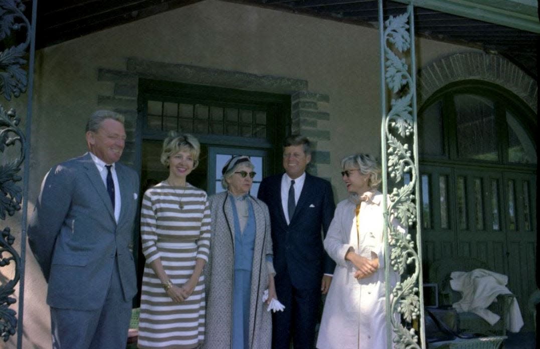 President John F. Kennedy and others stand outside Grey Towers, the home of Gifford Pinchot, following the dedication of the Pinchot Institute for Conservation Studies in Milford, Pennsylvania. Left to right: Gifford Bryce Pinchot; Antoinette Pinchot Bradlee; Ruth Pickering Pinchot; President Kennedy; Mary Pinchot Meyer. Photo: Cecil Stoughton. White House Photographs.