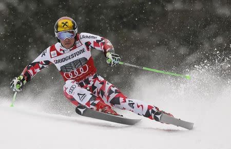 Marcel Hirscher of Austria clears a gate during his first run in the men's Alpine Skiing World Cup giant slalom in Garmisch-Partenkirchen March 1, 2015. REUTERS/Wolfgang Rattay