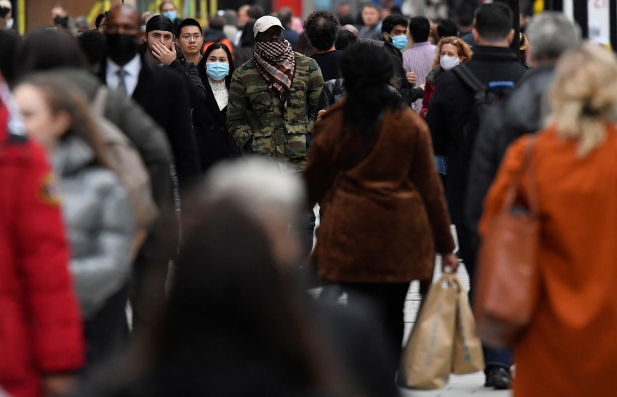 Shoppers walk along Oxford Street, in the centre of London's retail shopping area, amid the spread of the coronavirus disease (COVID-19) in London, Britain, October 16, 2020. REUTERS/Toby Melville