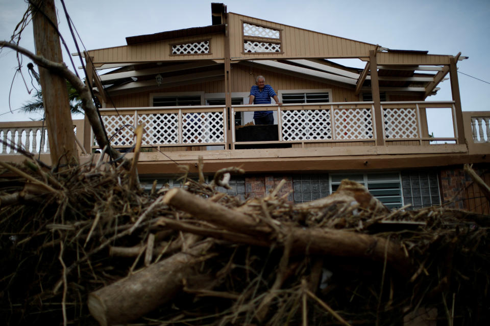 A man looks at the damages to his house after the area was hit by Hurricane Maria in Toa Baja, Puerto Rico. (Photo: Carlos Garcia Rawlins / Reuters)
