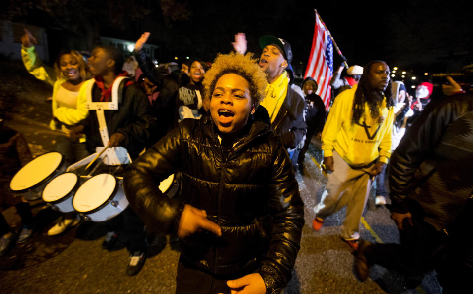 <p>Sabrina Webb, a cousin of Michael Brown, leads a protest near the site where the black 18-year-old was shot and killed by a white police officer in Ferguson, Mo on November 22, 2014. Hours after the announcement on November 24, 2017, that Officer Darren Wilson would not be indicted in the killing of Michael Brown, DeAndre Joshua, Webb’s friend, was shot and killed. (AP Photo/David Goldman) </p>