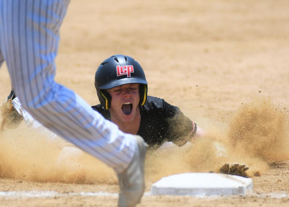 Lubbock-Cooper's Kylar Galmor slides into third base against Mansfield Legacy in Game 2 of their Region I-5A semifinal series Saturday, May 28, 2022, at Walt Driggers Field in Abilene.