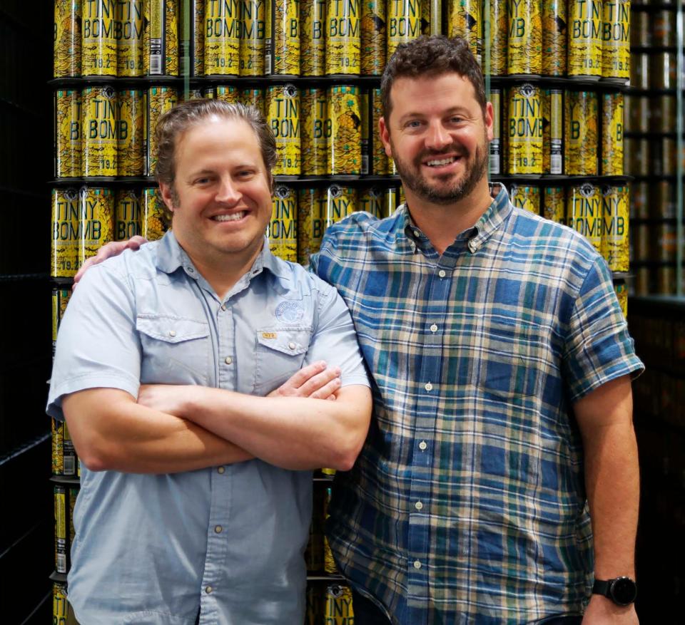 WISEACRE owners Davin Bartosch, left, and Kellan Bartosch pose for a photograph inside of WISEACRE's warehouse, at 398 S. B.B. King Blvd., on Aug. 18, 2023. The Memphis craft brewery, which has two locations, is celebrating 10 years in business.