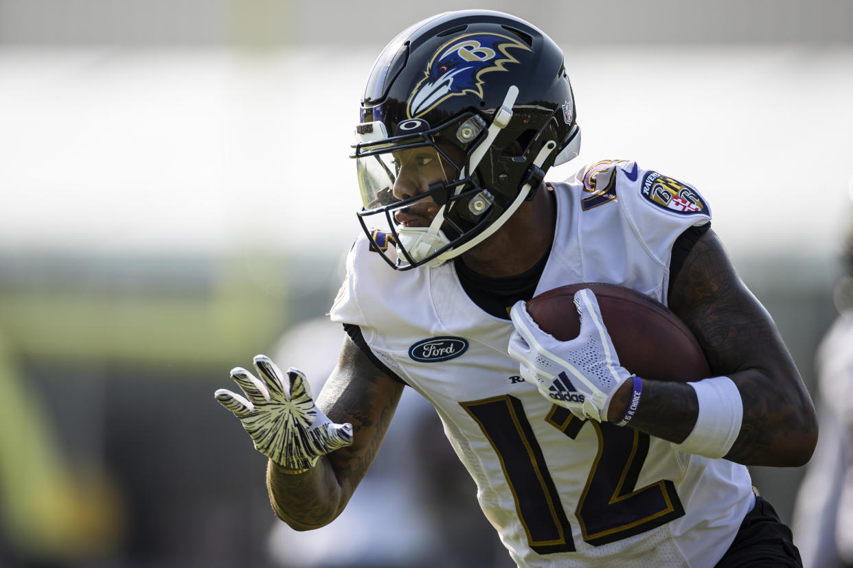 Rashod Bateman #12 of the Baltimore Ravens participates in a drill during training camp at Under Armour Performance Center Baltimore Ravens on July 28, 2021 in Owings Mills, Maryland. (Photo by Scott Taetsch/Getty Images)