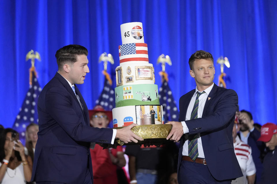 A birthday cake is carried onto the stage before Republican presidential candidate former President Donald Trump speaks at his birthday celebration, hosted by Club 47, in West Palm Beach, Fla., Friday, June 14, 2024. (AP Photo/Gerald Herbert)