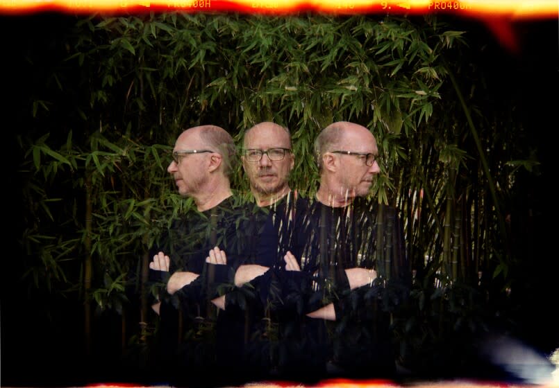 A triple-exposure portrait of a man with his arms crossed facing right, left and center