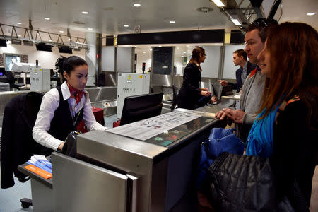 Travellers check in in the departure hall after a ceremony at Brussels Airport as it reopens 40 days after deadly attacks in Zaventem, Belgium, May 1, 2016. REUTERS/Eric Vidal