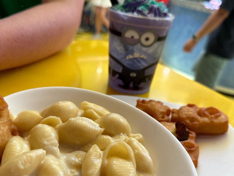 mac and cheese, chicken nuggets, and a drink from minion cafe in universal