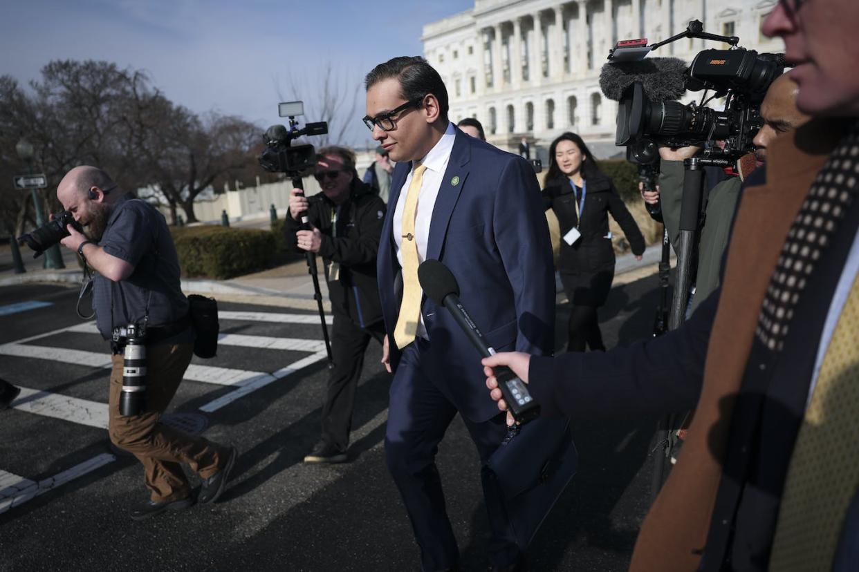 Rep. George Santos leaves the U.S. Capitol on Jan. 12, 2023, followed by reporters. <a href="https://media.gettyimages.com/id/1456010393/photo/embattled-newly-elected-rep-george-santos-is-sought-after-by-reporters-on-capitol-hill.jpg?s=1024x1024&w=gi&k=20&c=5qWU_1KtaUqMVDo7LvMqkWfmL8qHJmVE7XwbaG2rkn8=" rel="nofollow noopener" target="_blank" data-ylk="slk:Win McNamee/Getty Images;elm:context_link;itc:0;sec:content-canvas" class="link ">Win McNamee/Getty Images</a>