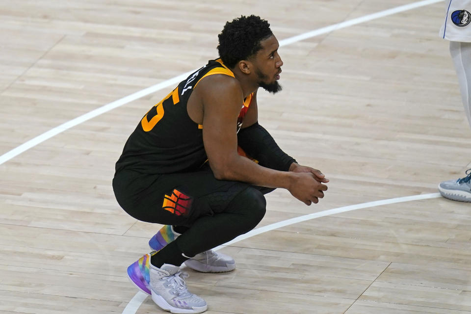 Utah Jazz guard Donovan Mitchell pauses on the court following the team's loss in Game 6 of an NBA basketball first-round playoff series against the Dallas Mavericks on Thursday, April 28, 2022, in Salt Lake City. The Mavericks advanced to the second round of the playoffs. (AP Photo/Rick Bowmer)