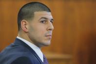 Former New England Patriots player Aaron Hernandez listens to testimony, during his murder trial at Bristol County Superior Court in Fall River, Massachusetts, February 24, 2015. Hernandez is accused of the murder of Odin Lloyd in June 2013. REUTERS/Brian Snyder (UNITED STATES - Tags: CRIME LAW SPORT FOOTBALL)
