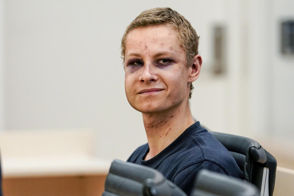 Suspected gunman Philip Manshaus appears in court, in Oslo, Norway, Monday, Aug. 12, 2019. A suspected gunman accused of an attempted terrorist attack on an Oslo mosque and separately killing his teenage stepsister &quot;will use his right not to explain himself for now&quot; in a detention hearing, his defense lawyer said Monday.  (Cornelius Poppen, NTB scanpix via AP)