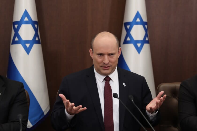 FILE - Israeli Prime Minister Naftali Bennett attends a cabinet meeting at the Prime Minister's office in Jerusalem, Sunday, June 19, 2022. Bennett's office announced Monday, June 20, 2022, that his weakened coalition will be disbanded and the country will head to new elections. Bennett has struggled to keep his unruly coalition of eight parties together, and defections have left the crumbling alliance without a majority in parliament for over two months. (Abir Sultan/Pool Photo via AP, File)