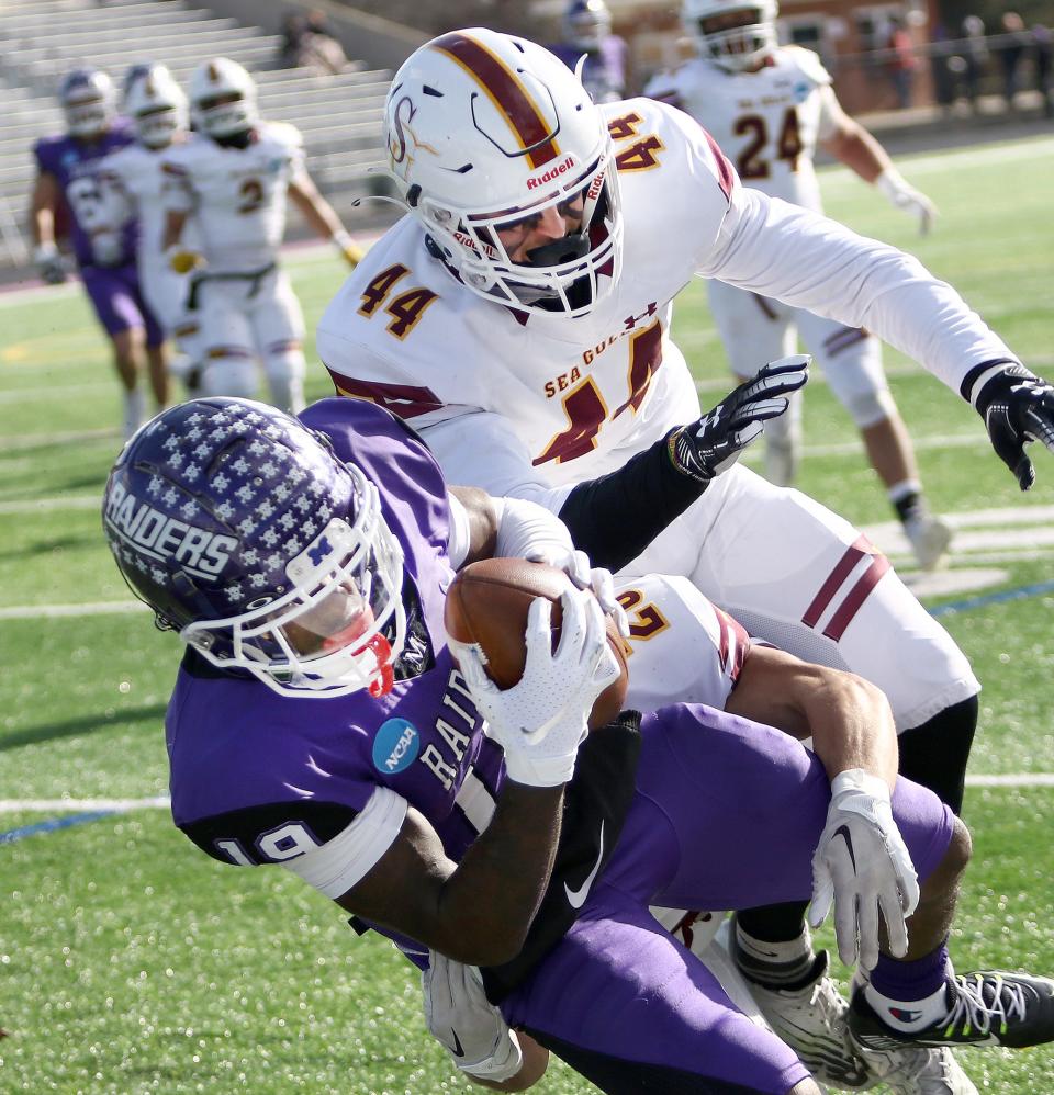 Mount Union's Wayne Ruby Jr., bottom, pulls in a first-half touchdown pass defended by Salisbury's Ryan Muller during an NCAA playoff game at Kehres Stadium Saturday, November 19, 2022.