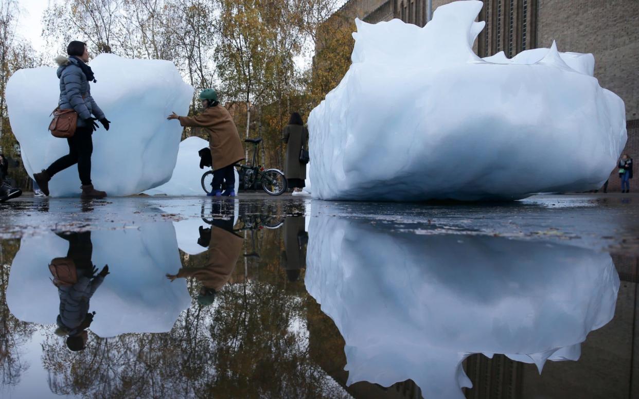 Blocks of melting ice outside the Tate Modern in London, an installation by the artist Olafur Eliasson highlighting the effects of climate change - AFP