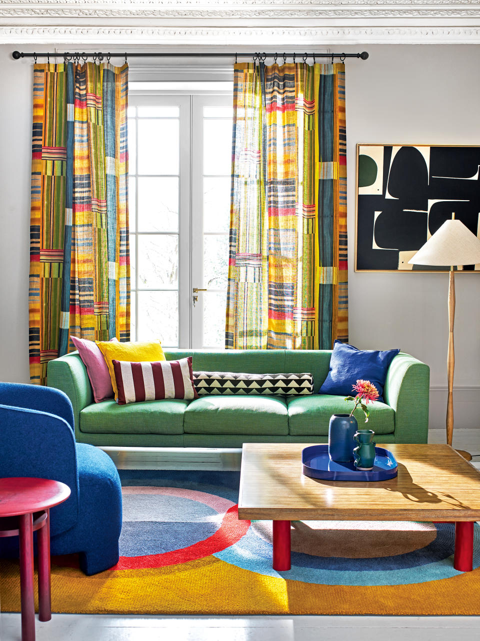 <p> For those confident with color, choosing a bold fabric can make a real statement as a drape. </p> <p> A riot of color reminiscent of Joseph&apos;s technicolor dream coat, Pierre Frey&apos;s Festival multicolore fabric perfectly brings together all the vibrant tones in this artistic scheme while the patchwork feel helps soften the bold shapes throughout the room.&#xA0; </p>