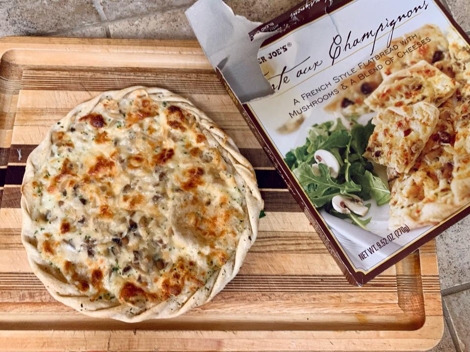 Cooked Trader JOe's tarte aux champignons beside original box