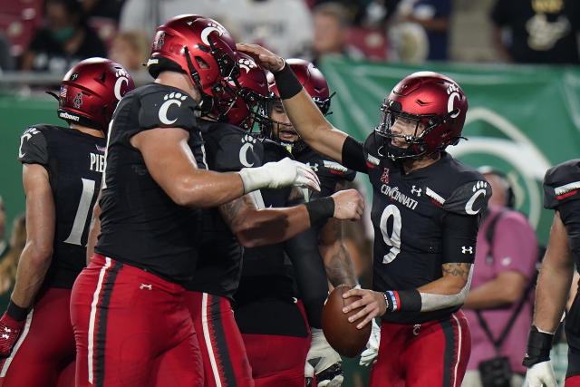 Ridder runs, passes No. 19 Cincinnati past No. 16 SMU, 42-13