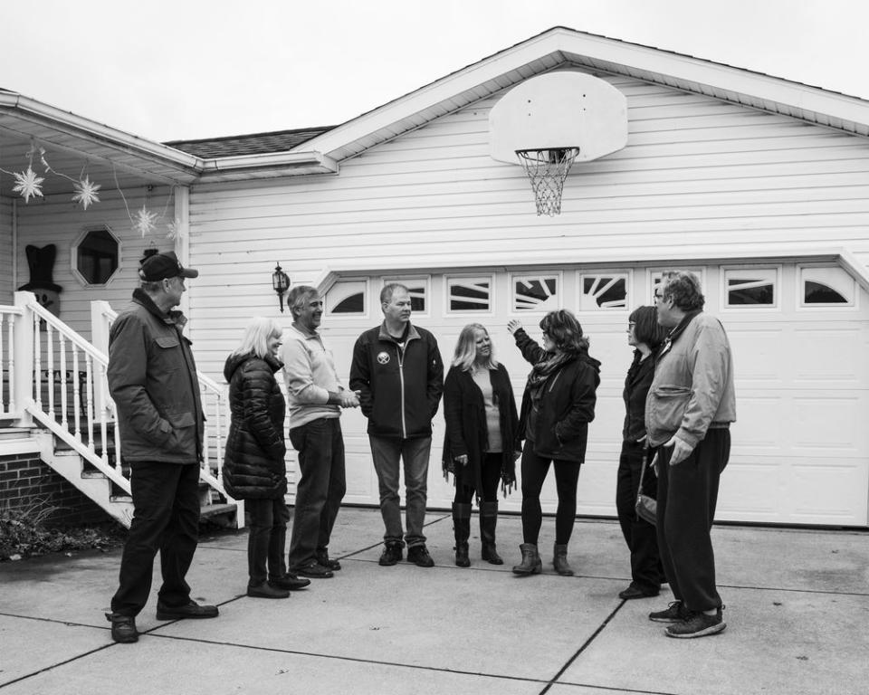 Maribeth Sheedy and her husband Shawn speak with other residents of the Akron Manufactured Home Community