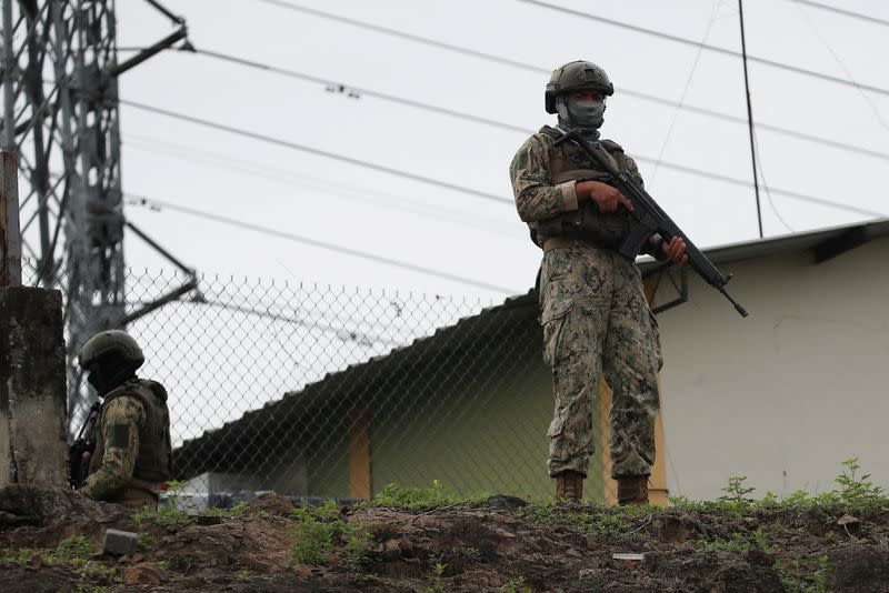 Members of Security Forces check an area near the Zonal 8 prison, from where Jose Adolfo Macias alias "Fito" disappeared earlier in the month, in Guayaquil