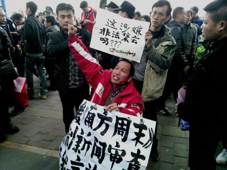 Demonstrators call for press freedom in support of journalists from the Southern Weekend newspaper outside the company's office building in Guangzhou on January 8, 2013. Protesters have mounted a second day of rallies calling for press freedom in China, as social media users and celebrities backed a campaign which poses a test for the nation's new leaders