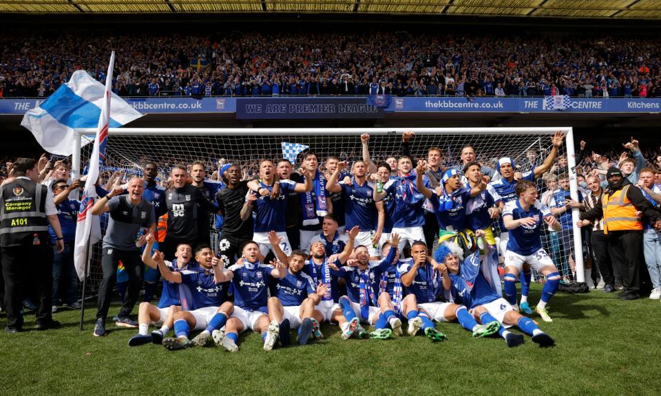 <span>The Ipswich players and coaching staff celebrate their promotion to the Premier League.</span><span>Photograph: Tom Jenkins/The Observer</span>