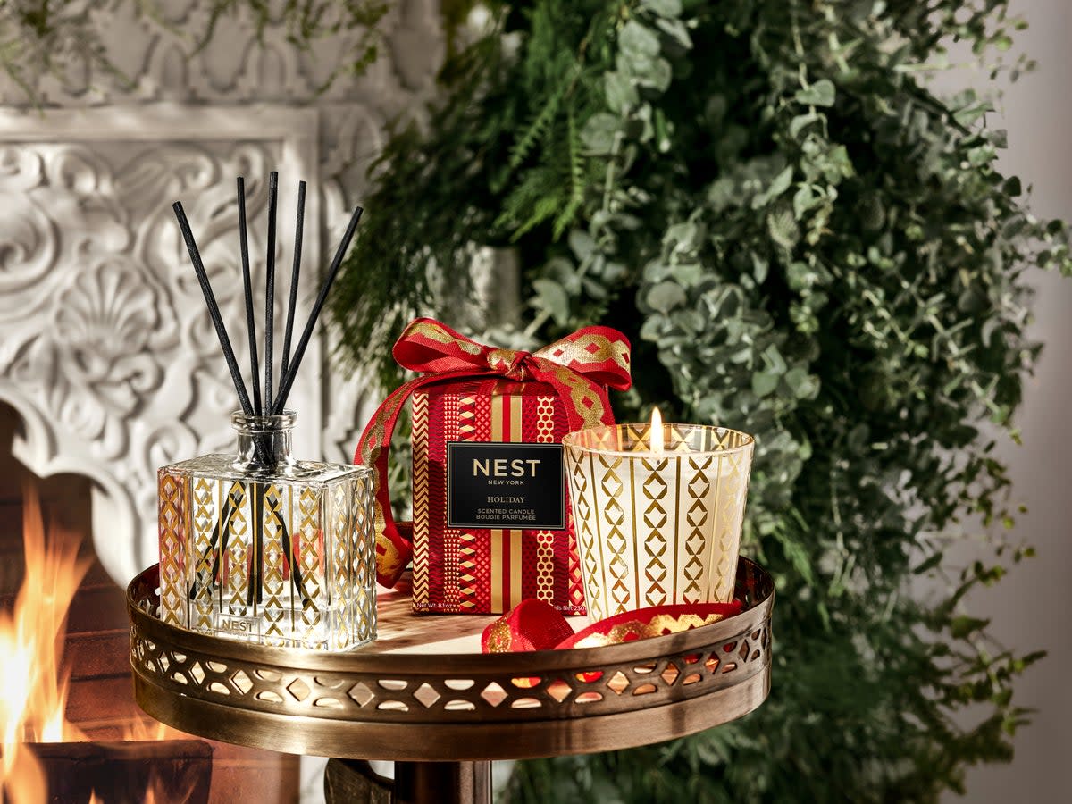 Nest ‘Holiday’ Candle gives off whiffs of pomegranate, mandarin orange, pine, cloves, and cinnamon (Supplied)
