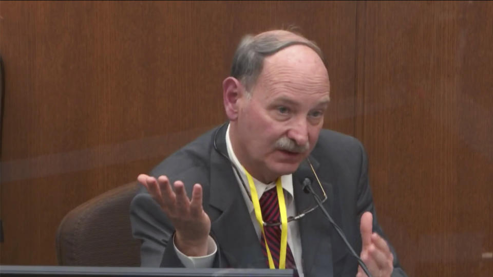 FILE - In this image from video, Dr. Bill Smock, a Louisville physician in forensic medicine, testifies in the trial of former Minneapolis police Officer Derek Chauvin, charged in the 2020 death of George Floyd, at the Hennepin County Courthouse in Minneapolis, Minn., on Thursday, April 8, 2021. Smock testified that he believes excited delirium is real. But he said Floyd met none of the 10 criteria developed by the American College of Emergency Physicians. In a statement posted on the National Association of Medical Examiners’ site on March 23, 2023, the leading group of medical experts says the term “excited delirium”should not be listed as a cause of death. Critics have said the term has been used to justify excessive force by police. (Court TV via AP, Pool)