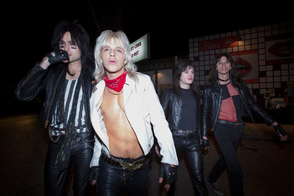 Motley Crue bandmates Nikki Sixx (Douglas Booth, far left), Vince Neil (Daniel Webber), Mick Mars (Iwan Rheon) and Tommy Lee (Colson Baker) own the L.A. rock scene in "The Dirt."