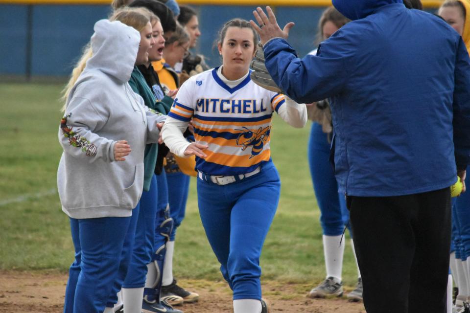 Malaya Tanglao high-fives teammates and coaches while being announced as a part of Mitchell&#39;s starting lineup against Paoli.