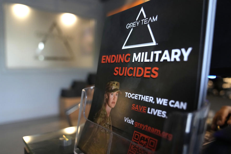 A placard about military suicides is displayed at the Grey Team veterans center, Thursday, May 11, 2023, in Boca Raton, Fla. The center is helping veterans with post-traumatic stress disorder and other mental and physical ailments get back into the civilian world. (AP Photo/Lynne Sladky)