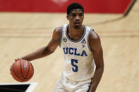 UCLA guard Chris Smith dribbles the ball during the second half of the team's NCAA college basketball game against Pepperdine, Friday, Nov. 27, 2020, in San Diego. (AP Photo/Gregory Bull)