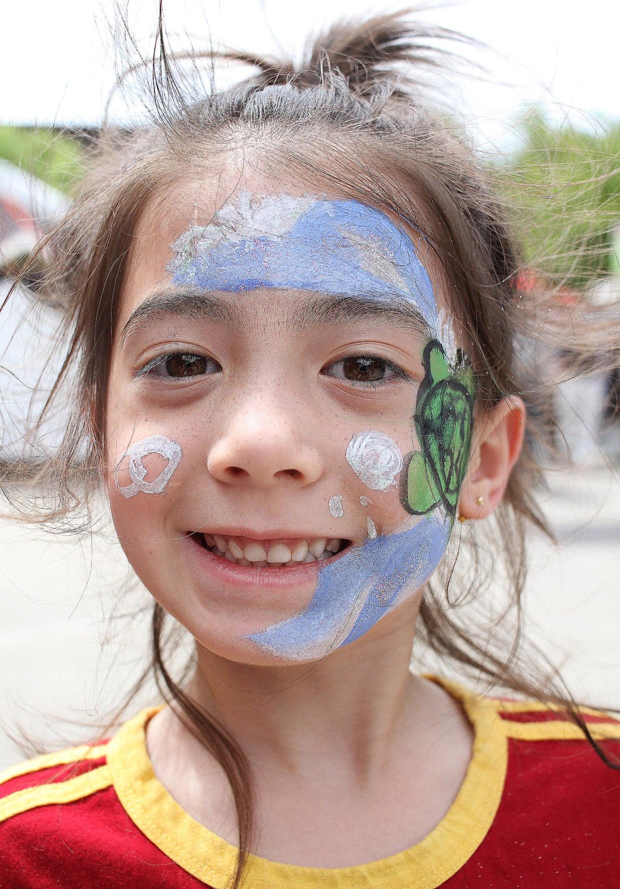 Naomi shows off her painted face at Gallatin's Squarefest on Saturday, April 30, 2022.