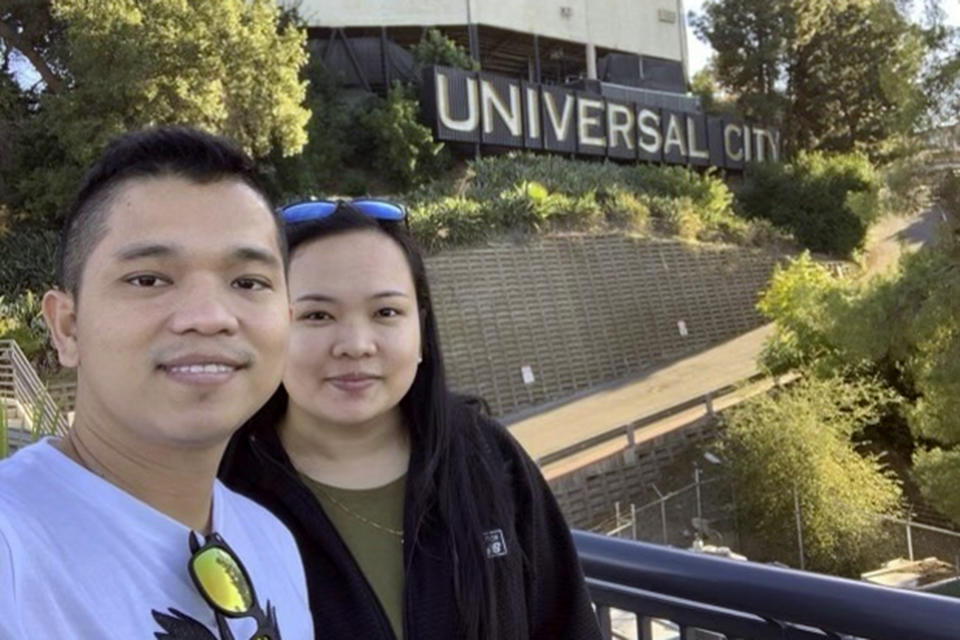 Kevin and Angelica Baclig take a selfie last November during a visit to Los Angeles. Angelica and her parents, as well as five of her other relatives who lived next door, remain missing after the Aug. 8 fire that destroyed Hawaii's historic town of Lahaina. Hope is hard to let go of as odds wane over reuniting with still-missing loved ones after a fire swept across the town of Lahaina on Hawaii's Maui island earlier this month. (Kevin Baclig via AP)
