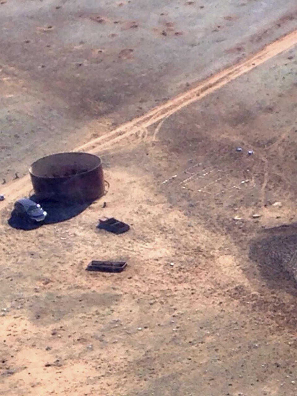 In this March 17, 2017, aerial photo released by the Arizona Department of Public Safety shows Amber VanHeckeher's vehicle of near the Grand Canyon in Arizona. The 24-year-old Texas college student was stranded for five days and had left signs on the car detailing where she was headed in search of cell phone signal, and rescuers eventually found her. (Arizona Department of Public Safety via AP)