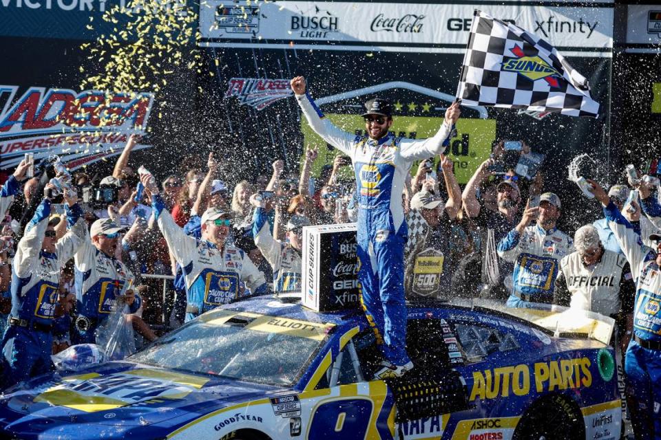 Chase Elliott celebrates in Victory Lane after winning a NASCAR Cup Series auto race Sunday, Oct. 2, 2022, in Talladega, Ala. (AP Photo/Butch Dill)