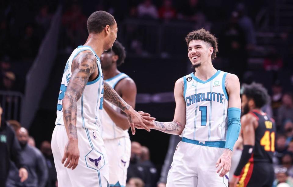 Charlotte Hornets guard LaMelo Ball (1), right, high fives Charlotte Hornets forward P.J. Washington (25) during their game against the Atlanta Hawks at the Spectrum Center in Charlotte, N.C., on Monday, February 13, 2023.