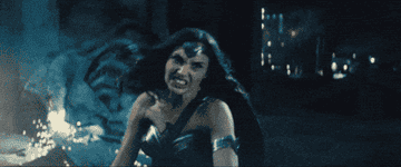 Gal Gadot as Wonder Woman fighting in an intense action scene from a movie