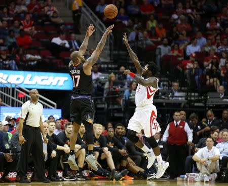 Apr 7, 2016; Houston, TX, USA; Phoenix Suns forward P.J. Tucker (17) shoots the ball over Houston Rockets guard Patrick Beverley (2) during the third quarter at Toyota Center. Mandatory Credit: Troy Taormina-USA TODAY Sports