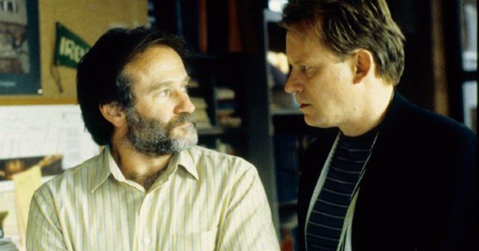 Robin Williams and Stellan Skarsgård looking at each other